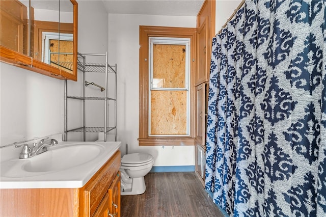 335 Queensbury Steet, Crafton Heights, PA 15205 - full bath with wood finished floors, vanity, baseboards, toilet, and a shower with shower curtain