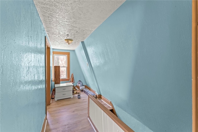 335 Queensbury Steet, Crafton Heights, PA 15205 - hallway featuring light wood-style floors, a textured wall, a textured ceiling, and baseboards