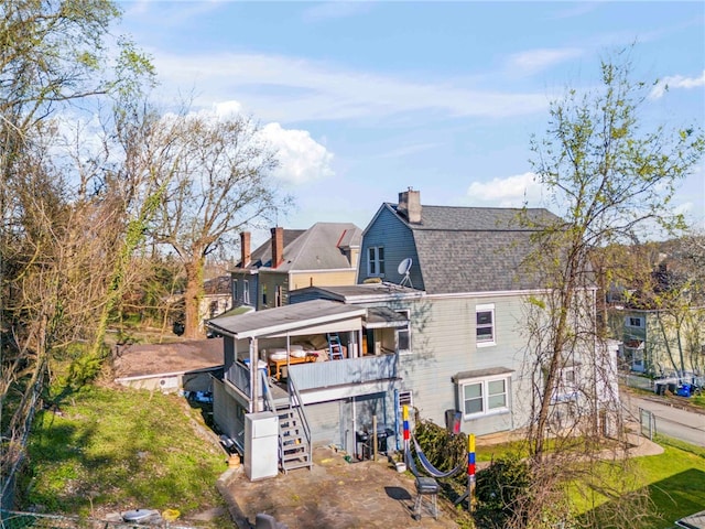 335 Queensbury Steet, Crafton Heights, PA 15205 - back of house with roof with shingles, a chimney, an attached garage, a gambrel roof, and stairway