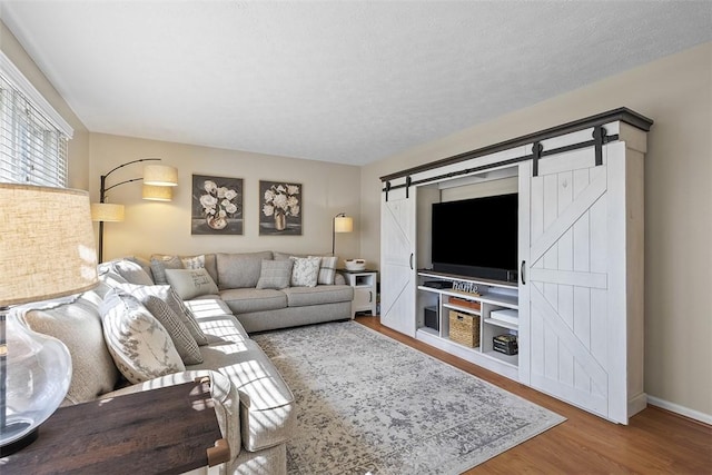 158 Edgemeade Dr, Monroeville, PA 15146 - living area featuring baseboards, wood finished floors, and a barn door