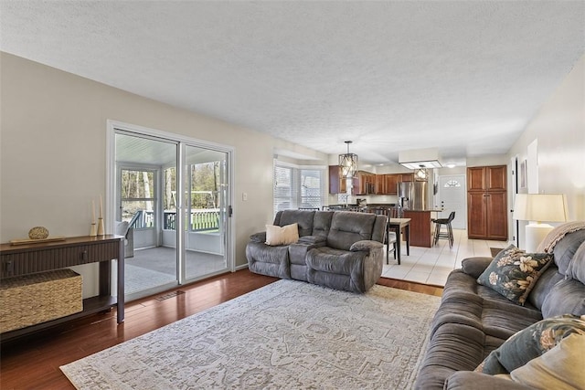 158 Edgemeade Dr, Monroeville, PA 15146 - living room featuring a textured ceiling and light wood-style flooring