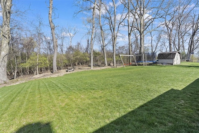 158 Edgemeade Dr, Monroeville, PA 15146 - view of yard featuring an outdoor structure, a storage unit, and a trampoline