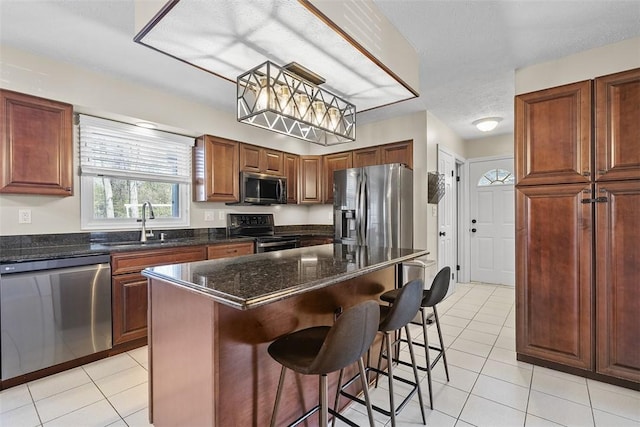 158 Edgemeade Dr, Monroeville, PA 15146 - kitchen featuring a kitchen breakfast bar, stainless steel appliances, light tile patterned flooring, and a sink