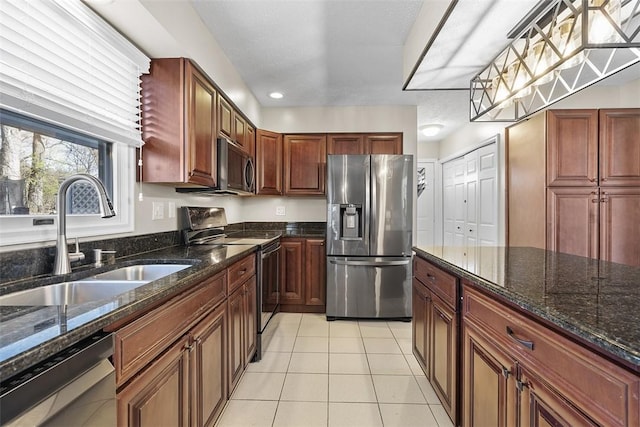 158 Edgemeade Dr, Monroeville, PA 15146 - kitchen featuring light tile patterned floors, a sink, dark stone countertops, and appliances with stainless steel finishes