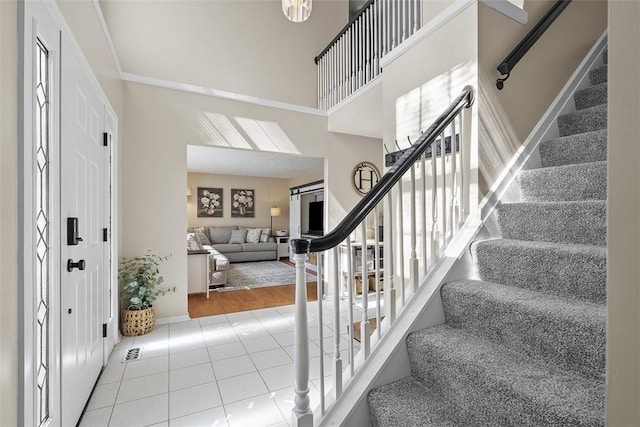 158 Edgemeade Dr, Monroeville, PA 15146 - foyer with tile patterned floors, baseboards, a high ceiling, and stairs
