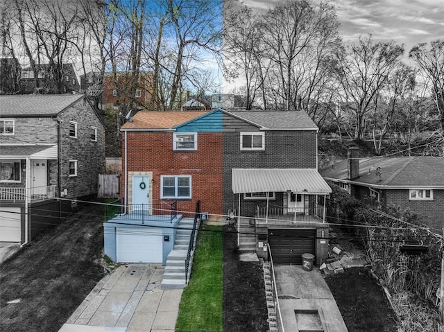 3906 Meadowbrook Blvd, Brentwood, PA 15227 - back of house featuring brick siding, driveway, fence, and a garage