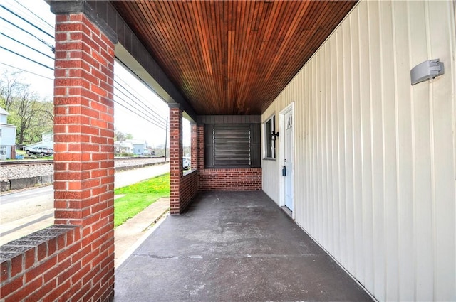 view of patio featuring a porch and a carport