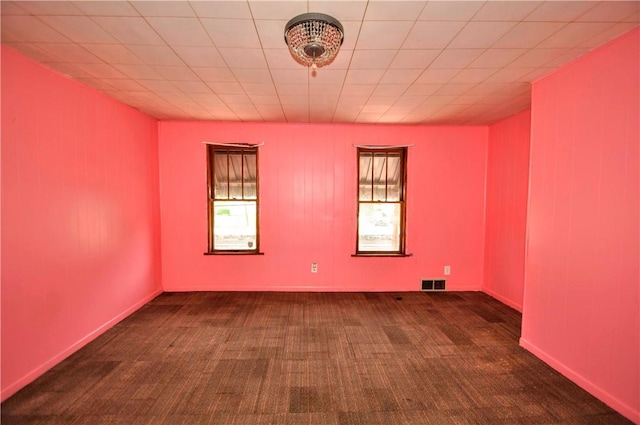 carpeted empty room with visible vents