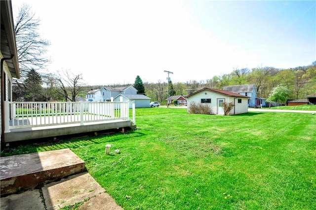 view of yard with a wooden deck
