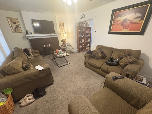 living room with carpet floors and a ceiling fan