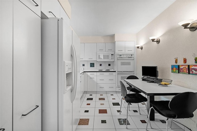 540 N Neville St Unit 402, Oakland, PA 15213 - kitchen featuring light tile patterned floors, white cabinetry, and white appliances