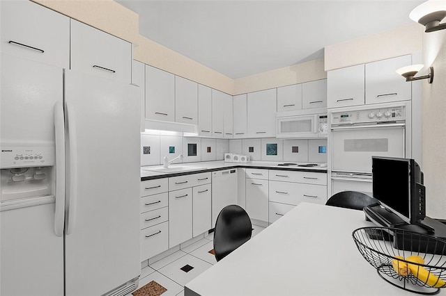 540 N Neville St Unit 402, Oakland, PA 15213 - kitchen featuring white cabinetry, a sink, and white appliances