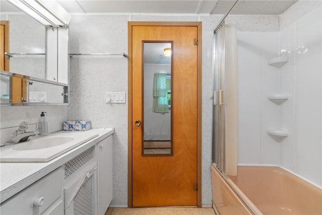 full bath featuring vanity and shower / bath combination with glass door