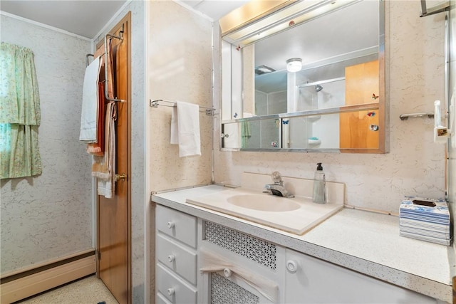 bathroom with baseboard heating and vanity