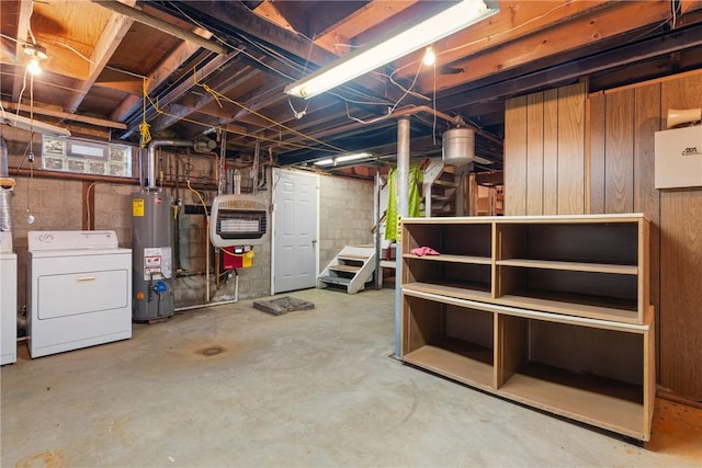 unfinished below grade area with independent washer and dryer, gas water heater, and heating unit