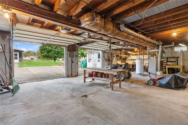 garage with gas water heater and electric panel