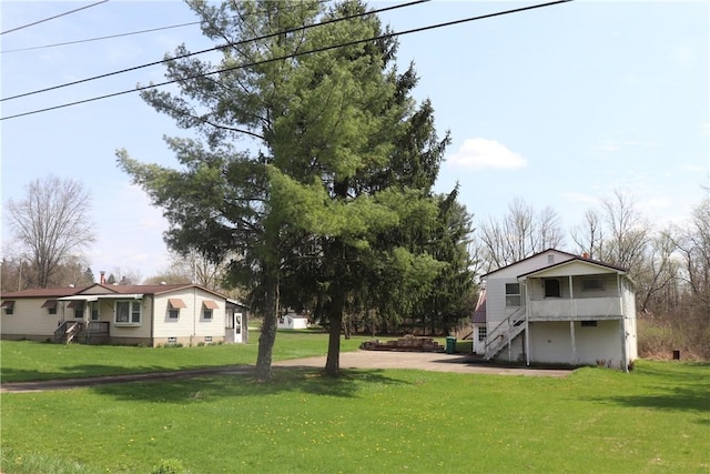 view of yard featuring stairs