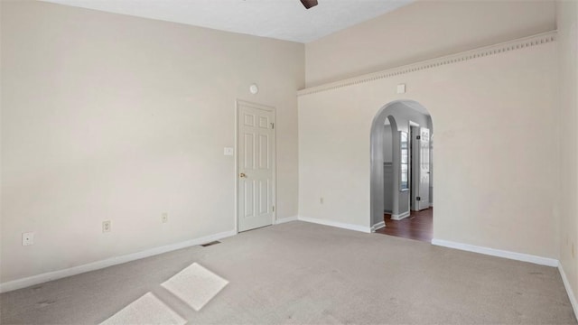 1420 Lexington Dr, Cecil, PA 15055 - carpeted empty room with arched walkways, visible vents, baseboards, and ceiling fan