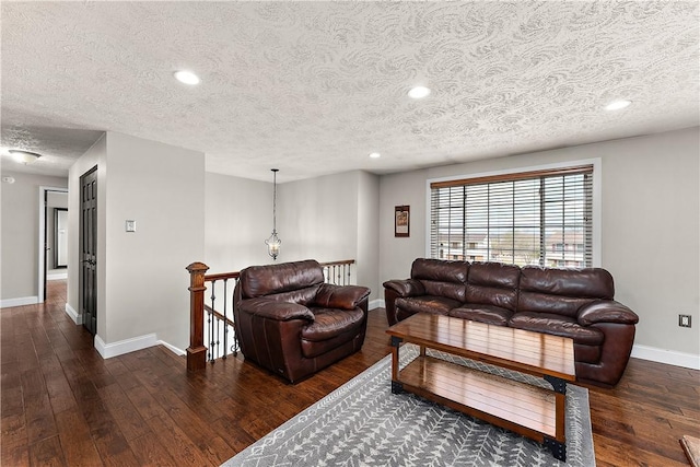 living room with recessed lighting, baseboards, a textured ceiling, and hardwood / wood-style floors