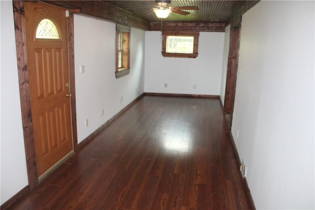 entryway with a ceiling fan, wood finished floors, and baseboards