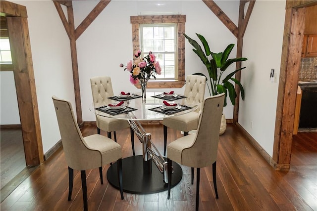 dining area with wood-type flooring, healthy amount of natural light, and baseboards