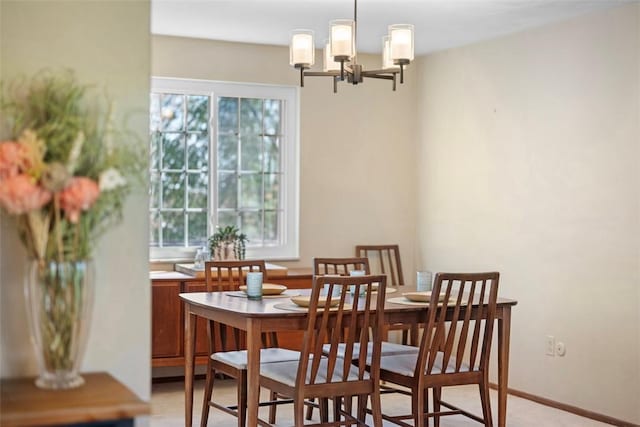 dining space featuring a chandelier