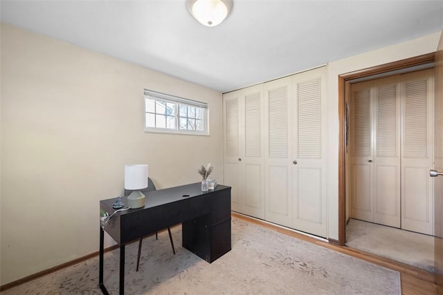office space with baseboards