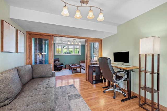 office space with wood finished floors