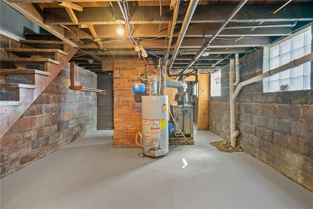 below grade area with gas water heater and stairs