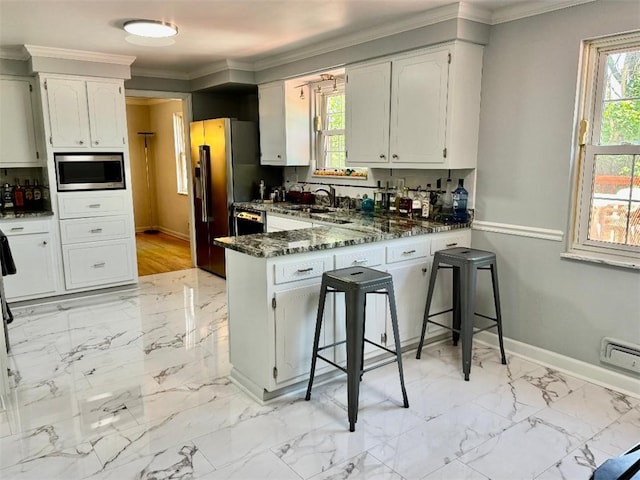 3619 Mccrady Rd, Churchill Boro, PA 15235 - kitchen featuring stainless steel microwave, a peninsula, plenty of natural light, a sink, and ornamental molding