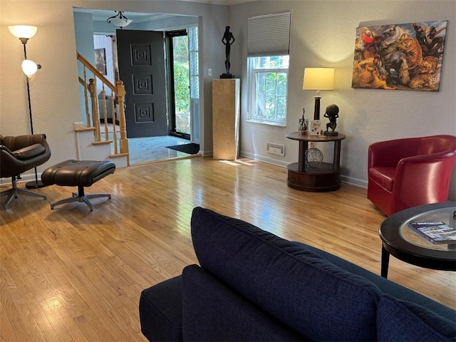 3619 Mccrady Rd, Churchill Boro, PA 15235 - living room featuring wood finished floors, stairs, baseboards, and a textured wall
