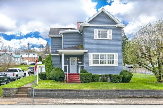 815 Franklin Ave, Connellsville, PA 15425 - traditional-style house featuring fence and a front lawn