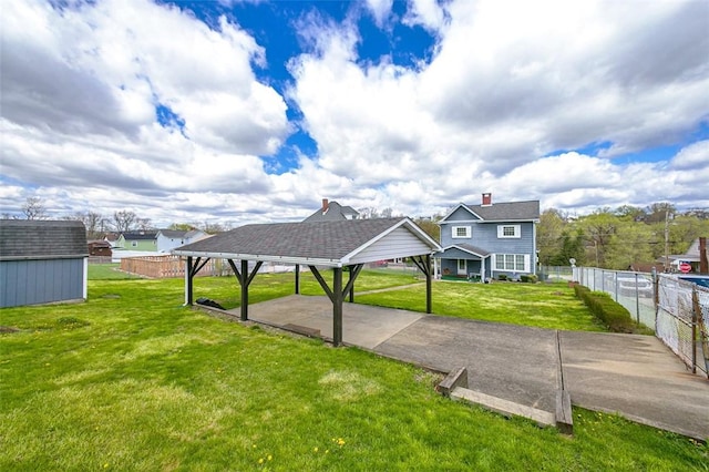 815 Franklin Ave, Connellsville, PA 15425 - view of front of house with fence, driveway, an outbuilding, a detached carport, and a front yard