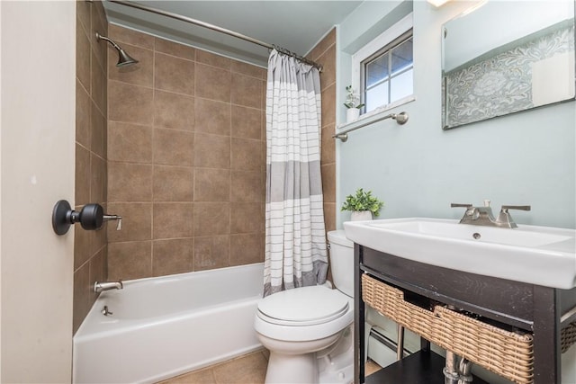 full bathroom with tile patterned flooring, baseboard heating, toilet, a sink, and shower / tub combo