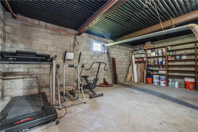 interior space with concrete block wall