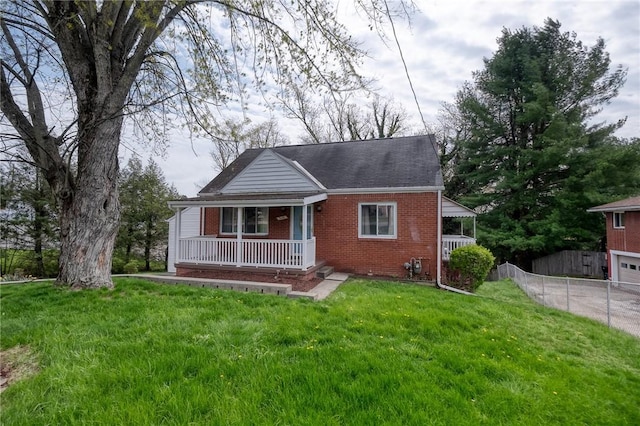 3181 Coulterville Rd, North Huntingdon, PA 15131 - bungalow with brick siding, covered porch, a shingled roof, and driveway