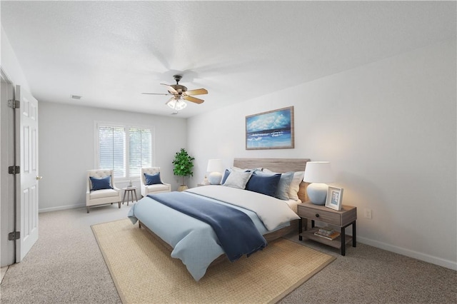bedroom with visible vents, a ceiling fan, baseboards, and light carpet