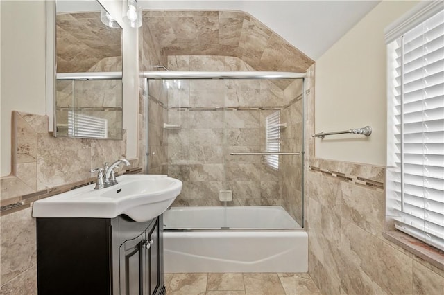 4203 Mckee Dr, Whitehall, PA 15236 - bathroom with vanity, shower / bath combination with glass door, and tile walls
