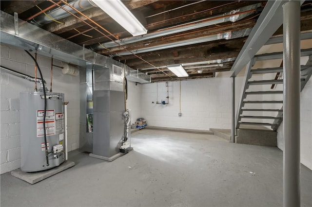 4203 Mckee Dr, Whitehall, PA 15236 - unfinished basement with concrete block wall, heating unit, water heater, and stairs