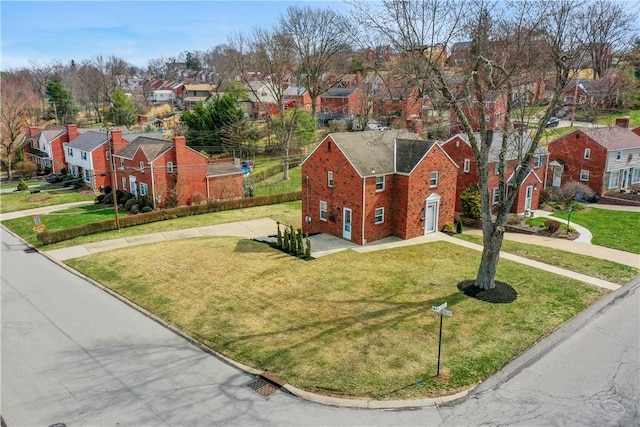 4203 Mckee Dr, Whitehall, PA 15236 - view of front of property with driveway, brick siding, a front yard, and a residential view