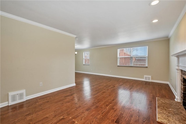 4203 Mckee Dr, Whitehall, PA 15236 - unfurnished living room featuring a fireplace with flush hearth, wood finished floors, visible vents, and crown molding