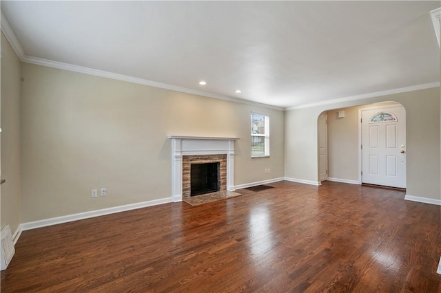 4203 Mckee Dr, Whitehall, PA 15236 - unfurnished living room featuring a fireplace with flush hearth, arched walkways, baseboards, wood finished floors, and ornamental molding