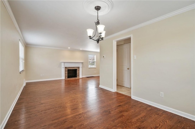 4203 Mckee Dr, Whitehall, PA 15236 - unfurnished living room with an inviting chandelier, crown molding, wood finished floors, and baseboards