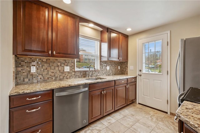 4203 Mckee Dr, Whitehall, PA 15236 - kitchen with decorative backsplash, stainless steel appliances, a sink, and a healthy amount of sunlight