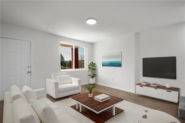 living area featuring wood finished floors and baseboards