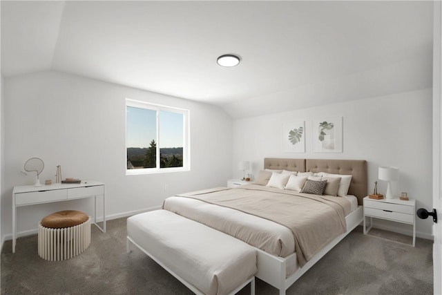 carpeted bedroom with lofted ceiling and baseboards