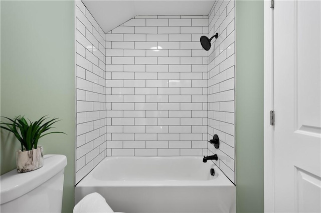 bathroom with washtub / shower combination and toilet