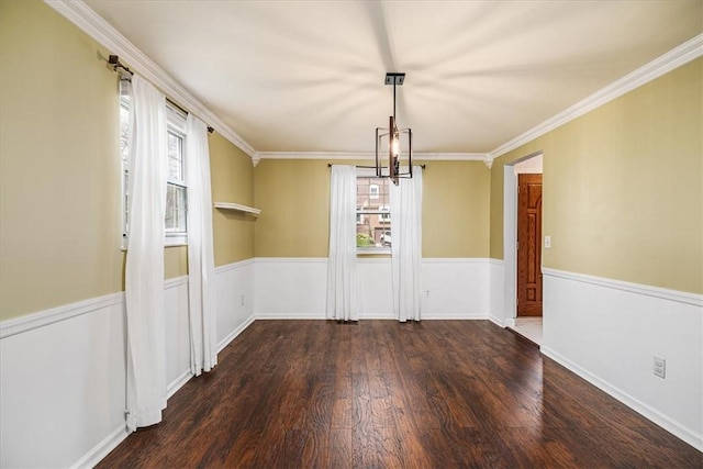 unfurnished dining area featuring wood finished floors and ornamental molding