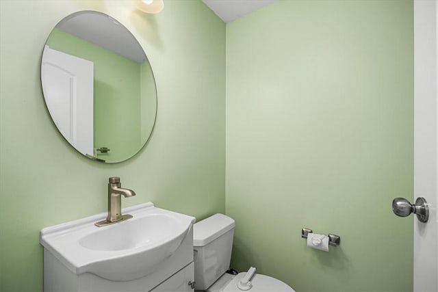 bathroom featuring toilet and vanity