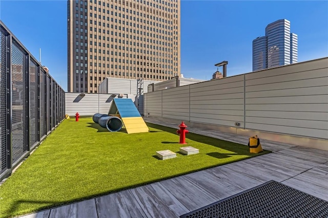 exterior space with fence and a yard